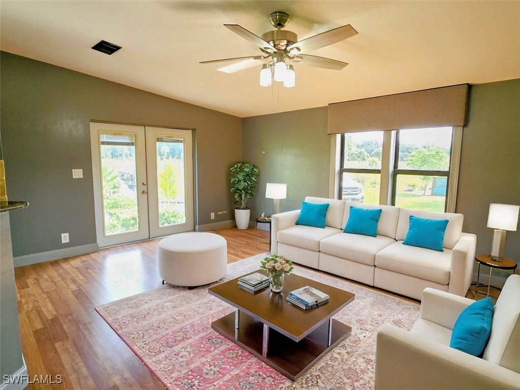 4650 County Road 78 LaBelle, FL 33935 - Photo 9 of 21 a living room with furniture and a large window