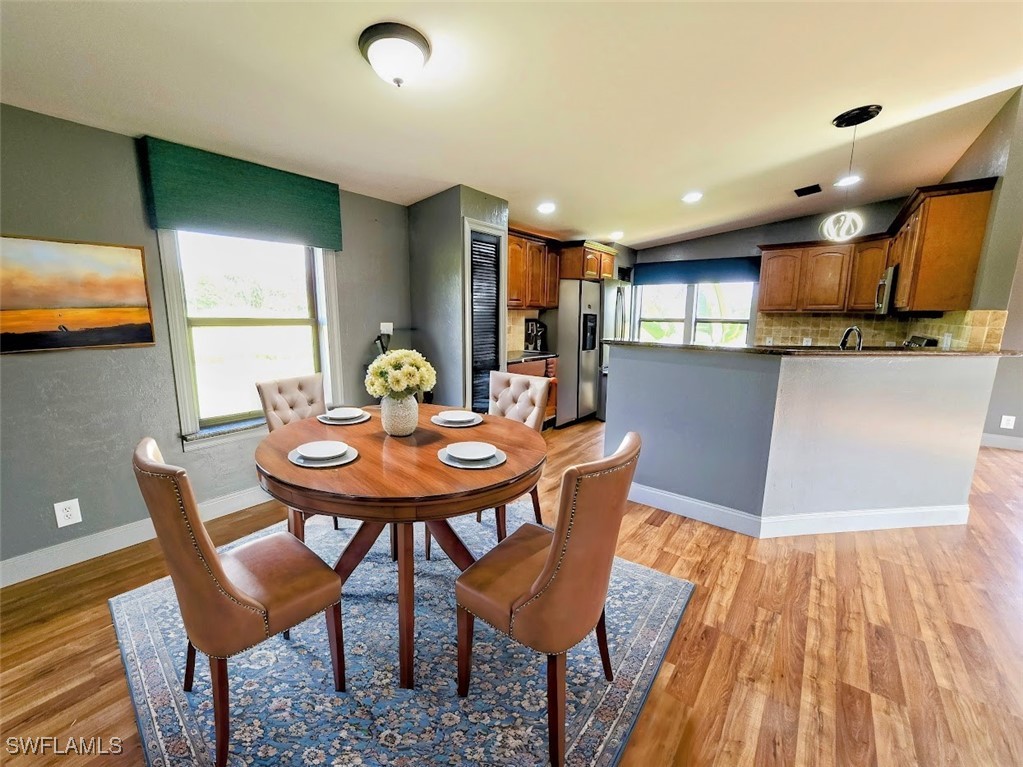 4650 County Road 78 LaBelle, FL 33935 - Photo 10 of 21 a view of a dining room with furniture and wooden floor