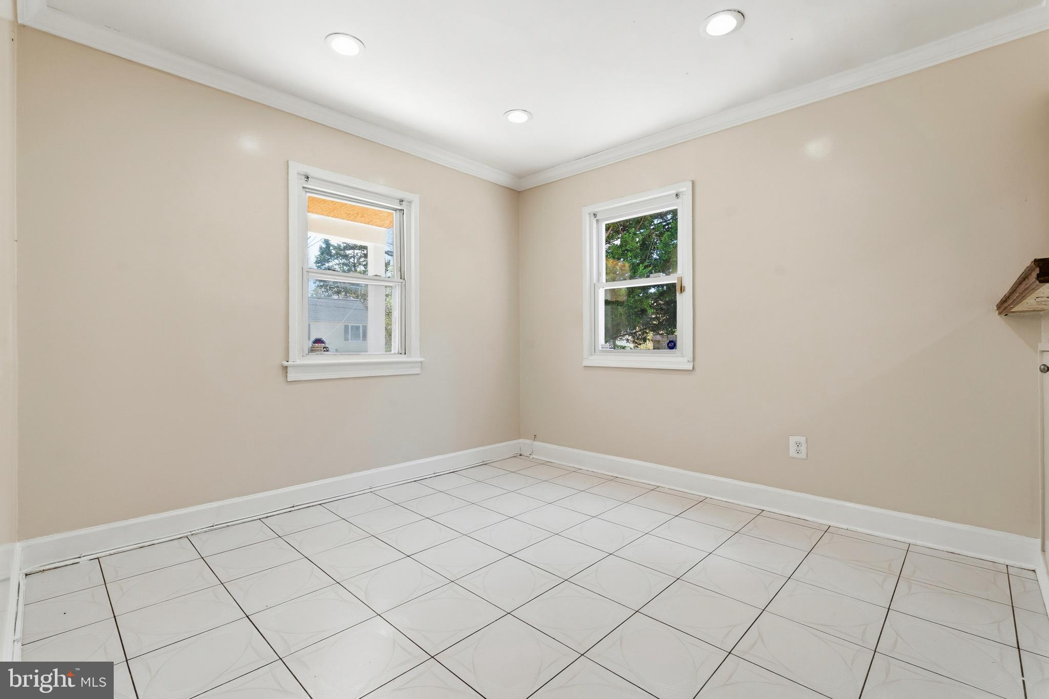 7204 East Inwood Street Landover, MD 20785 - Photo 7 of 24 an empty room with windows