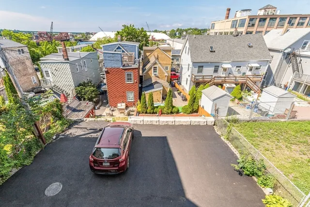 an aerial view of a house with a swimming pool yard and outdoor seating