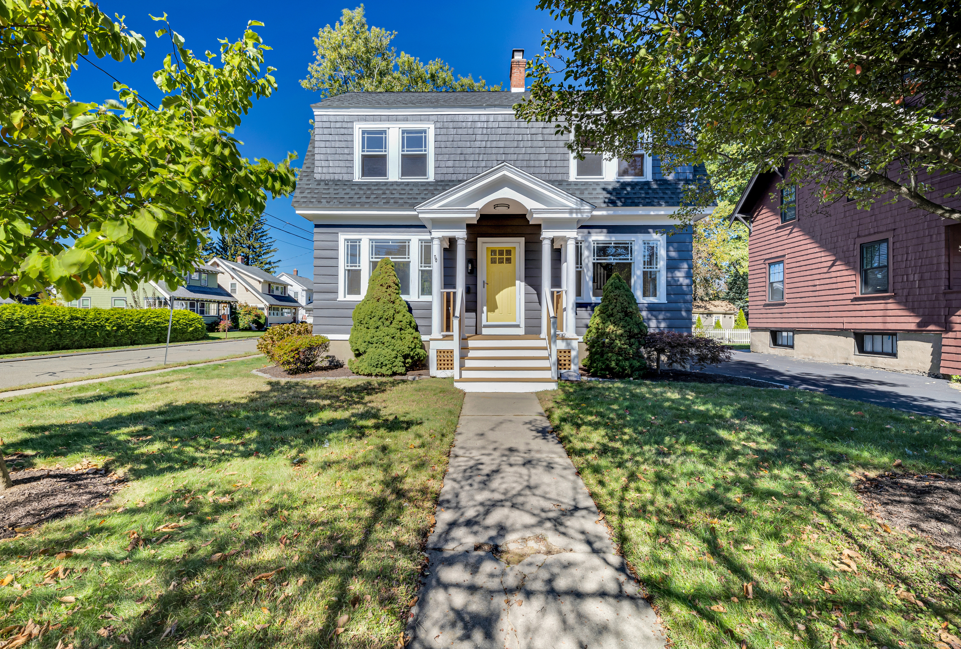 a front view of a house with a yard