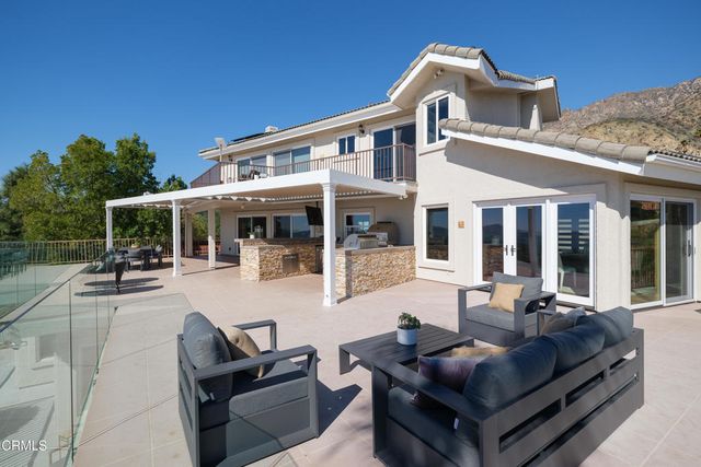 a view of a livingroom with furniture and a window