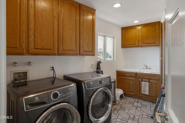a view of a house with a backyard and a garden