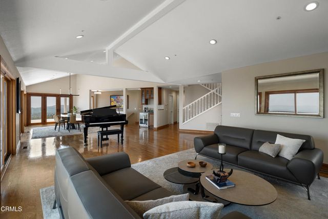a view of living room with furniture and fireplace