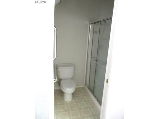 a bathroom with a toilet and a vanity