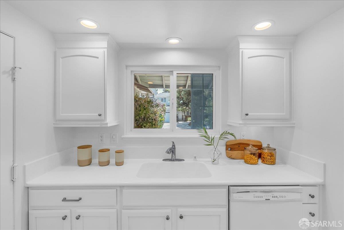 2083 Seacliff Drive Milpitas, CA 95035 - Photo 18 of 59 a kitchen with stainless steel appliances granite countertop white cabinets white wooden cabinets and a sink