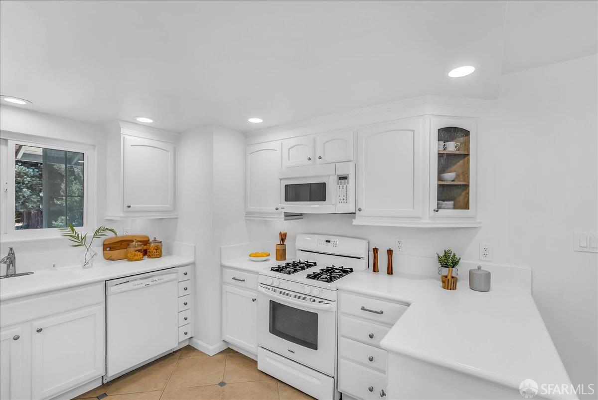 2083 Seacliff Drive Milpitas, CA 95035 - Photo 19 of 59 a kitchen with stainless steel appliances granite countertop white cabinets and a sink