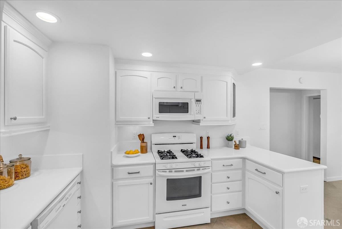 2083 Seacliff Drive Milpitas, CA 95035 - Photo 20 of 59 a kitchen with white cabinets stainless steel appliances and sink