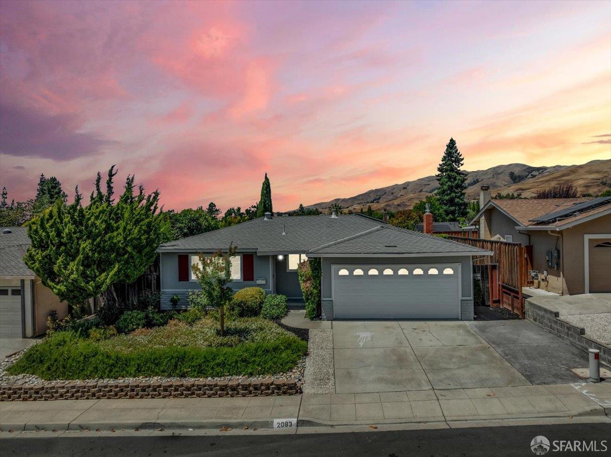2083 Seacliff Drive Milpitas, CA 95035 - Photo 2 of 59 a front view of a house with a yard and garage