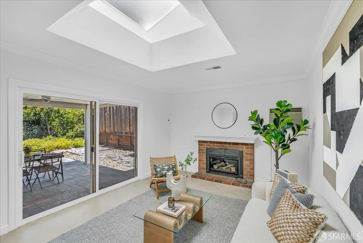2083 Seacliff Drive Milpitas, CA 95035 - Photo 24 of 59 a living room with furniture a window and a fireplace