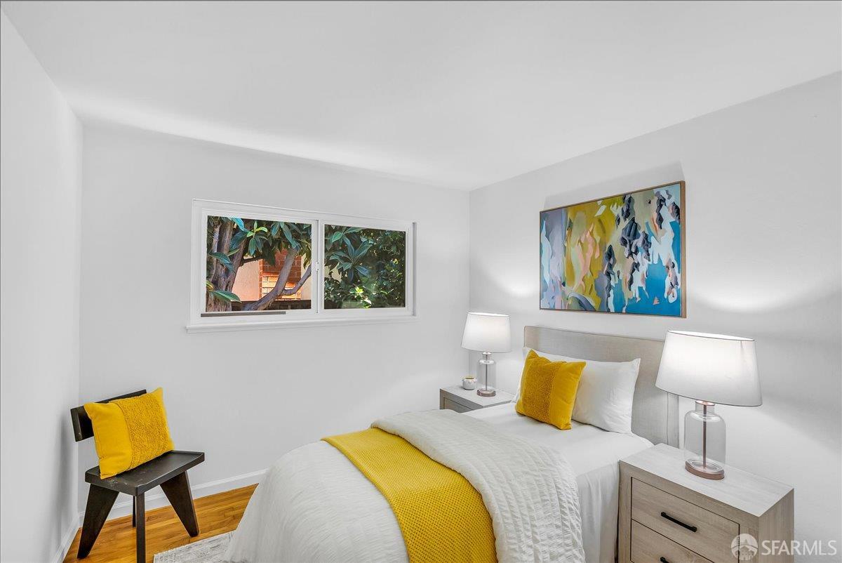 2083 Seacliff Drive Milpitas, CA 95035 - Photo 29 of 59 a bedroom with a bed and a lamp on dresser