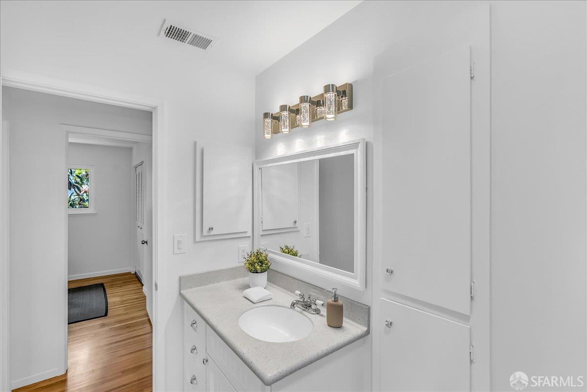 2083 Seacliff Drive Milpitas, CA 95035 - Photo 37 of 59 a bathroom with a sink and a mirror