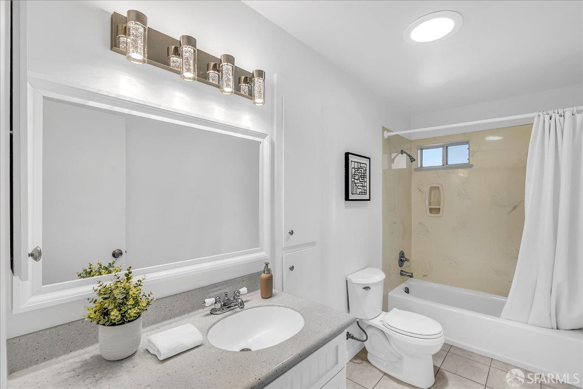 2083 Seacliff Drive Milpitas, CA 95035 - Photo 38 of 59 a bathroom with a granite countertop sink a toilet and shower