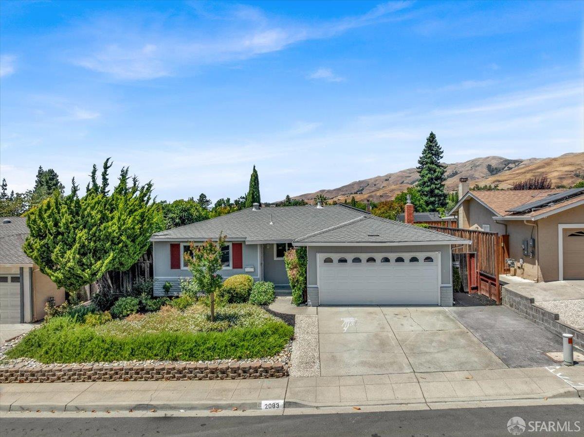2083 Seacliff Drive Milpitas, CA 95035 - Photo 5 of 59 a front view of a house with a garden
