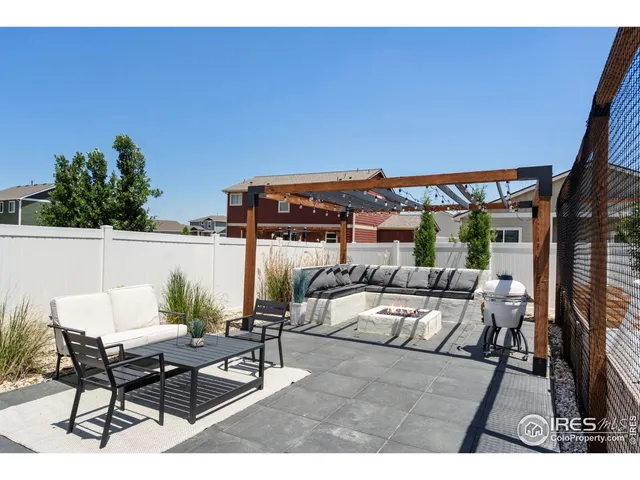 a terrace of a house with outdoor seating