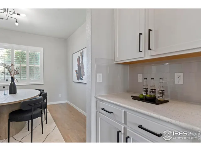 a kitchen with cabinets and window