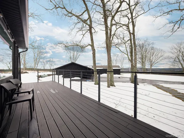 a view of a wooden deck with table and chairs