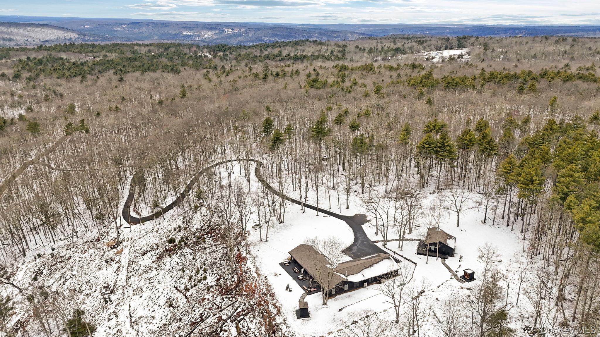 125 Mapes Road Barryville, NY 12719 - Photo 2 of 37 a view of wooden floor and a building in the background