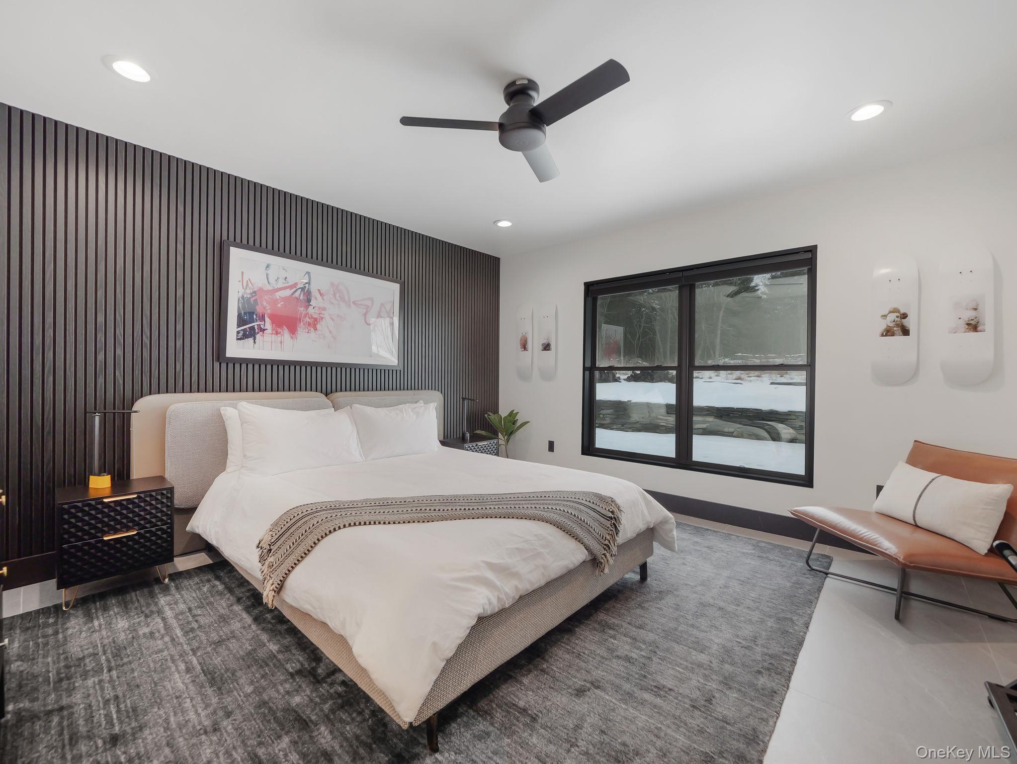 125 Mapes Road Barryville, NY 12719 - Photo 26 of 37 a bedroom with a bed and a chandelier