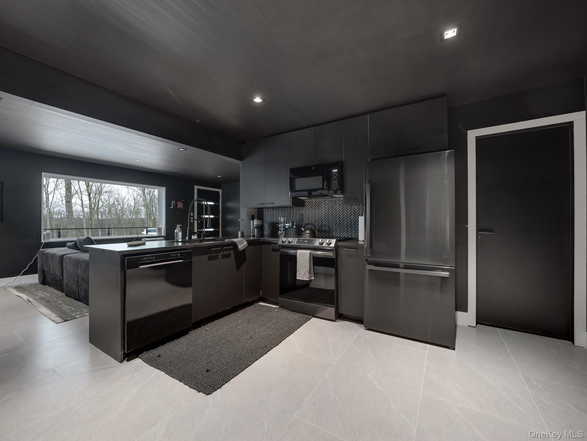 125 Mapes Road Barryville, NY 12719 - Photo 32 of 37 a kitchen with granite countertop a refrigerator oven a sink and dishwasher