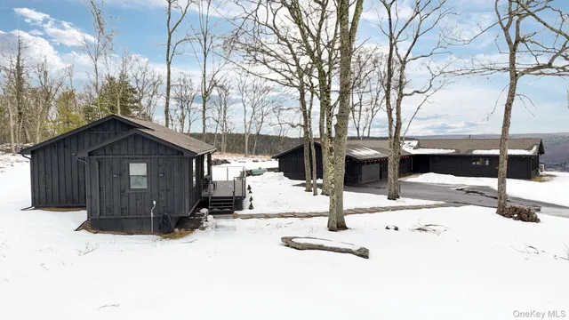 a view of a house covered in snow