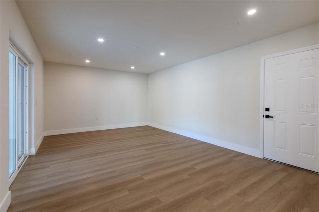 3324 Haystack Road Wesley Chapel, FL 33543 - Photo 29 of 91 a view of an empty room with wooden floor