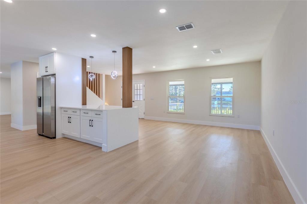 3324 Haystack Road Wesley Chapel, FL 33543 - Photo 34 of 91 a view of an empty room with wooden floor and a window