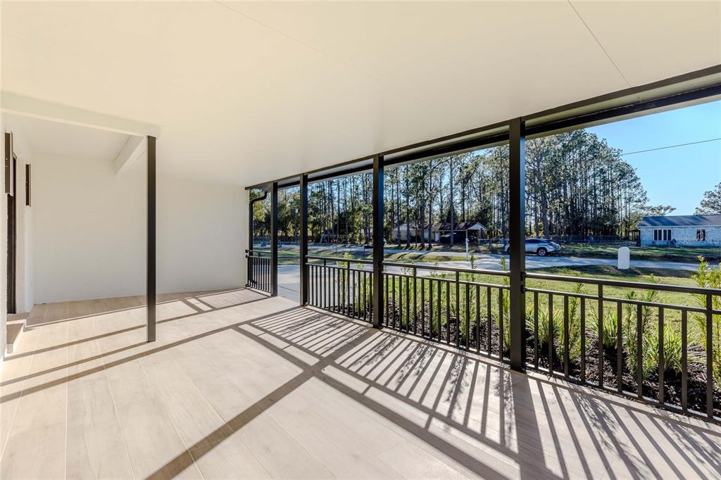3324 Haystack Road Wesley Chapel, FL 33543 - Photo 37 of 91 a view of a balcony with wooden floor