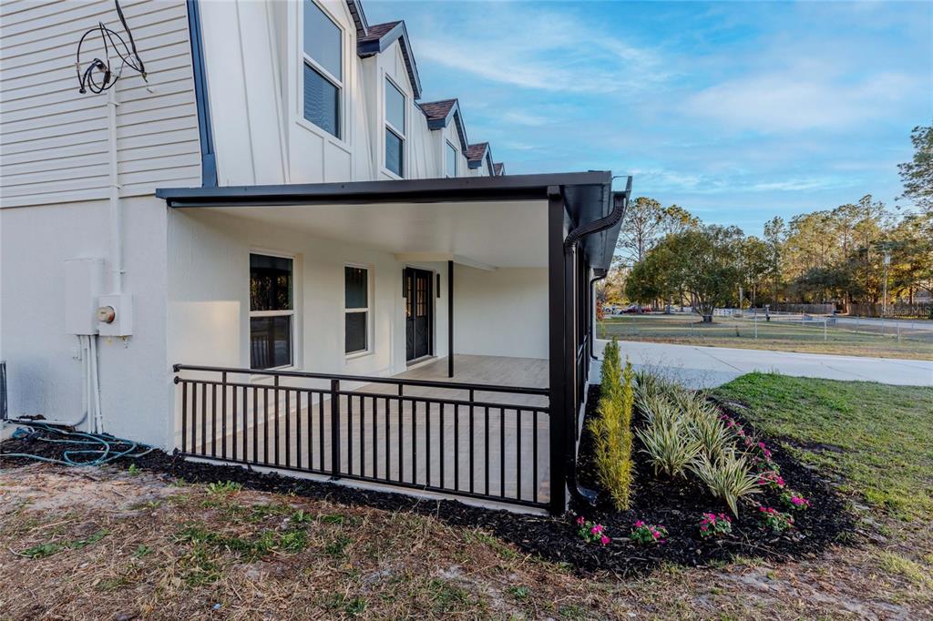 3324 Haystack Road Wesley Chapel, FL 33543 - Photo 44 of 91 a view of a house with a porch