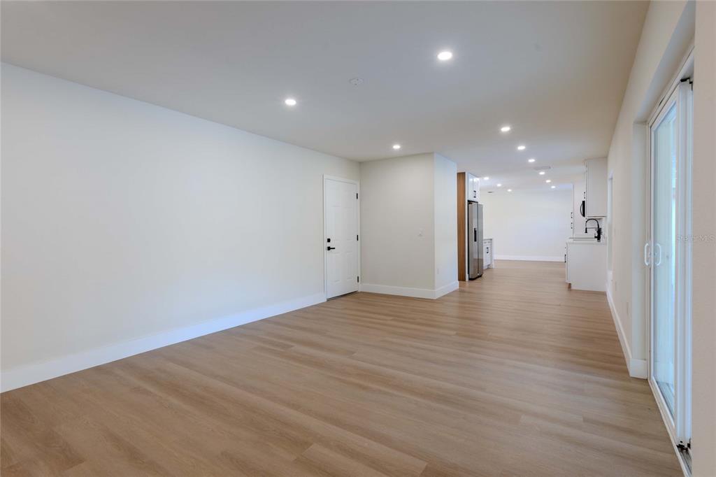 3324 Haystack Road Wesley Chapel, FL 33543 - Photo 49 of 91 a view of an empty room with wooden floor