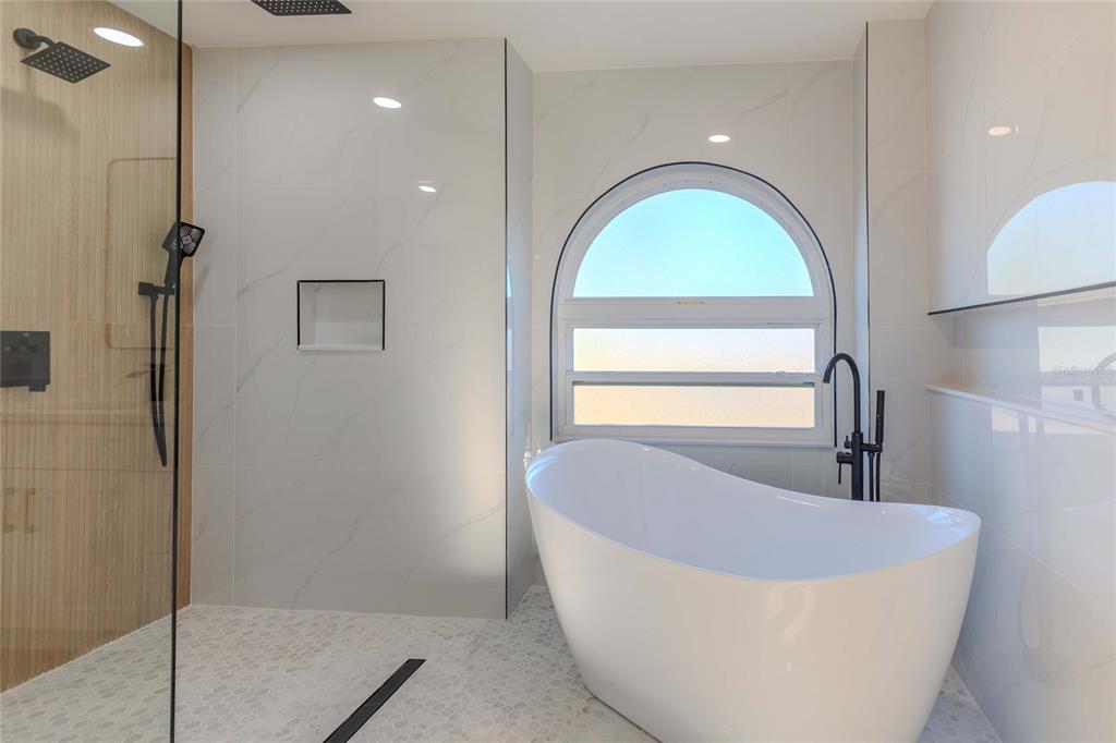 3324 Haystack Road Wesley Chapel, FL 33543 - Photo 60 of 91 a view of a bathtub in a bathroom