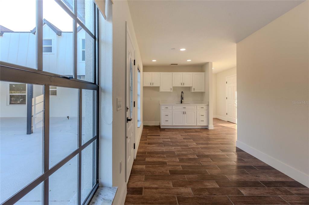 3324 Haystack Road Wesley Chapel, FL 33543 - Photo 62 of 91 a view of a hallway with a kitchen