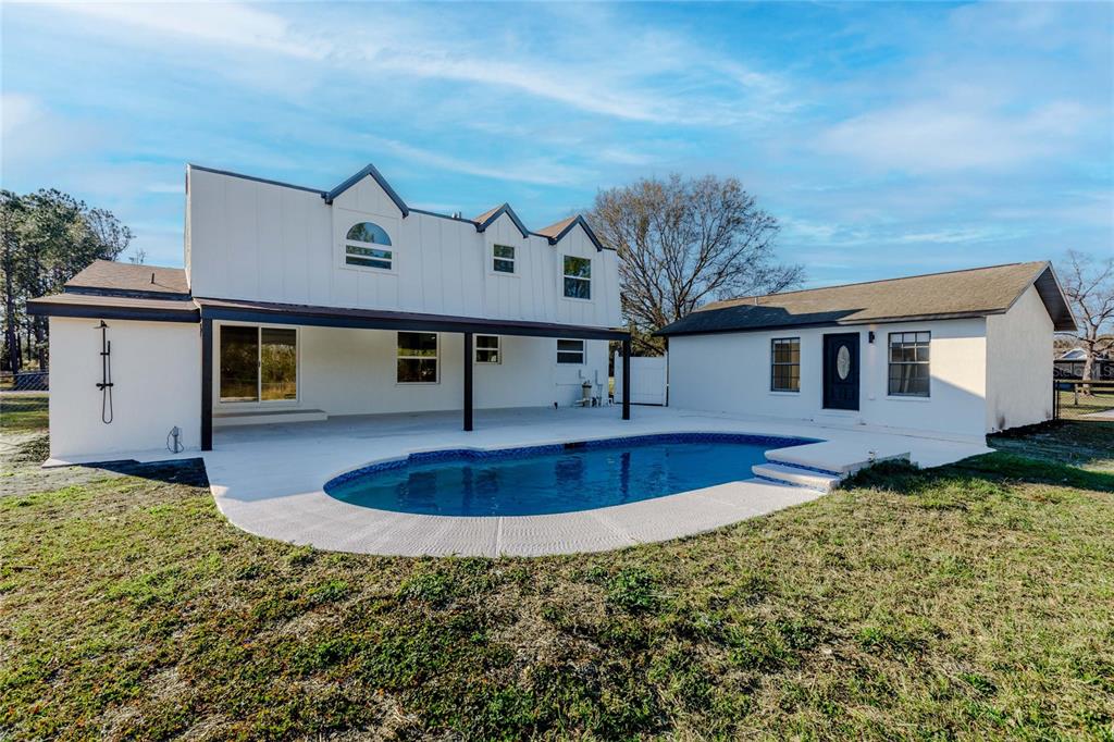 3324 Haystack Road Wesley Chapel, FL 33543 - Photo 70 of 91 a front view of a house with garden