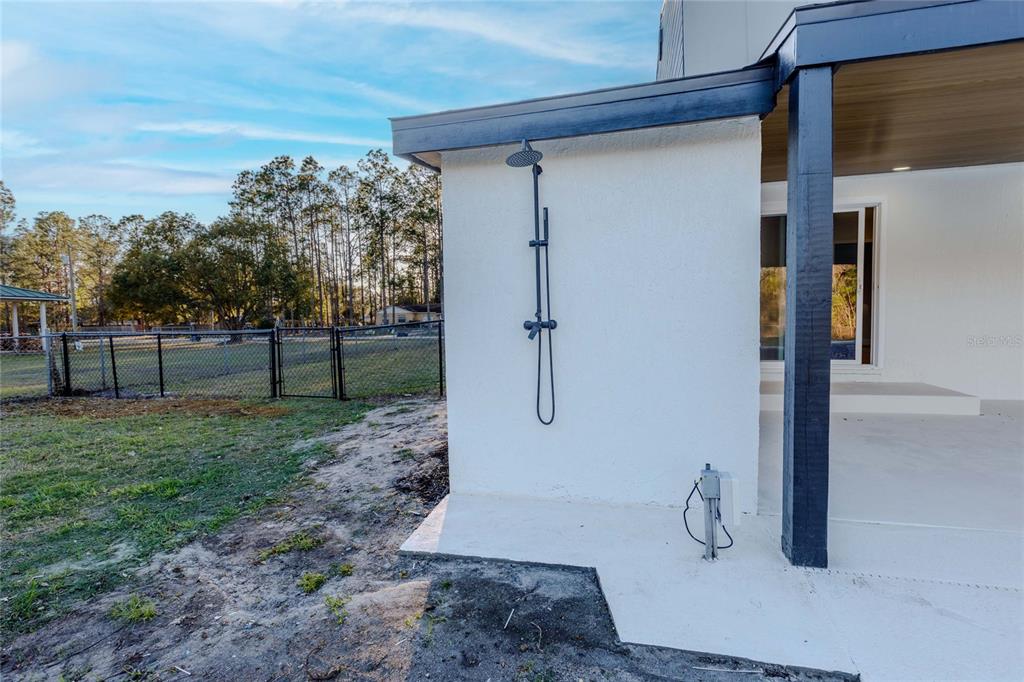 3324 Haystack Road Wesley Chapel, FL 33543 - Photo 74 of 91 a view of a porch with a trees