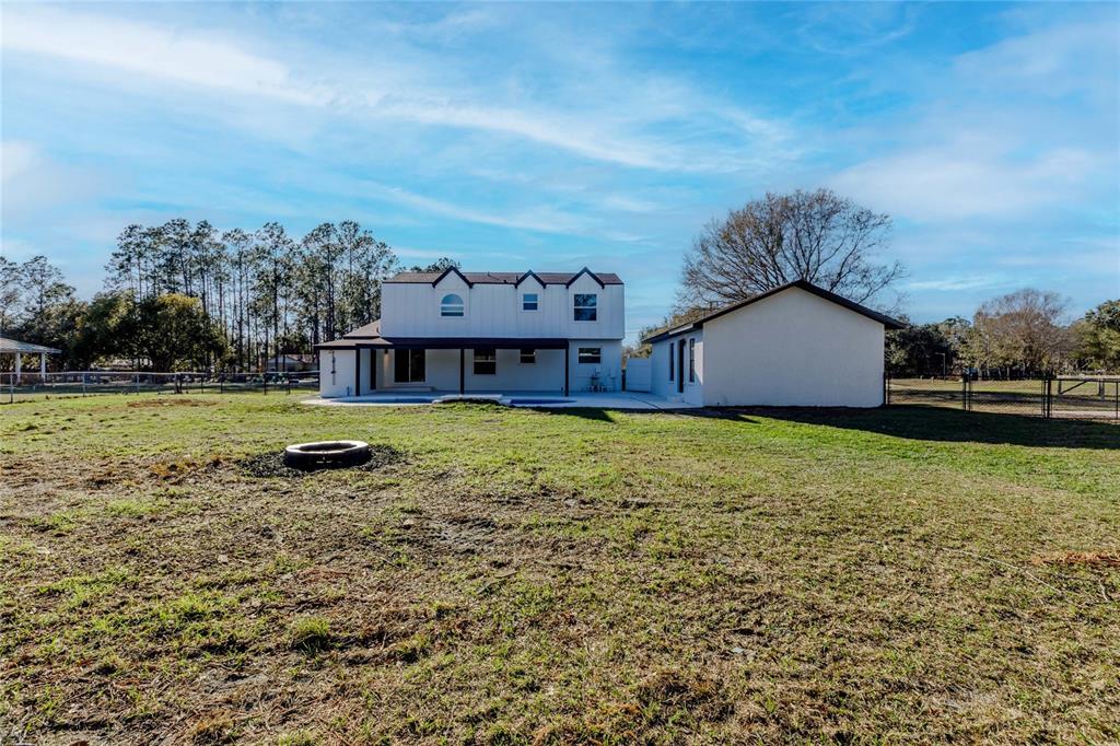 3324 Haystack Road Wesley Chapel, FL 33543 - Photo 75 of 91 a view of a house with a big yard