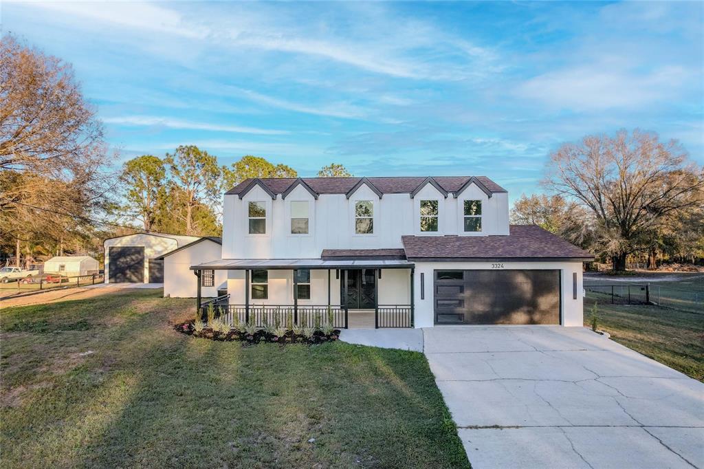 3324 Haystack Road Wesley Chapel, FL 33543 - Photo 82 of 91 front view of a house with a yard