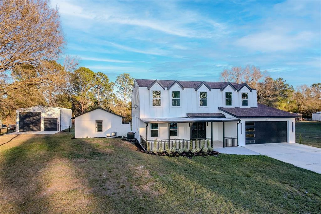 3324 Haystack Road Wesley Chapel, FL 33543 - Photo 83 of 91 front view of a house with a big yard