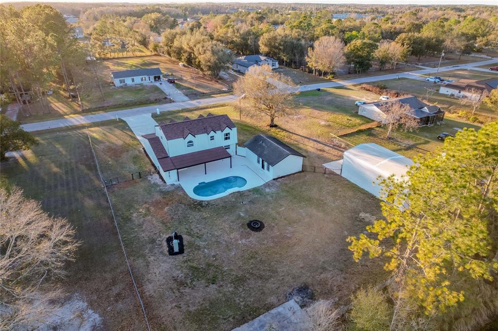 3324 Haystack Road Wesley Chapel, FL 33543 - Photo 89 of 91 an aerial view of residential houses with outdoor space