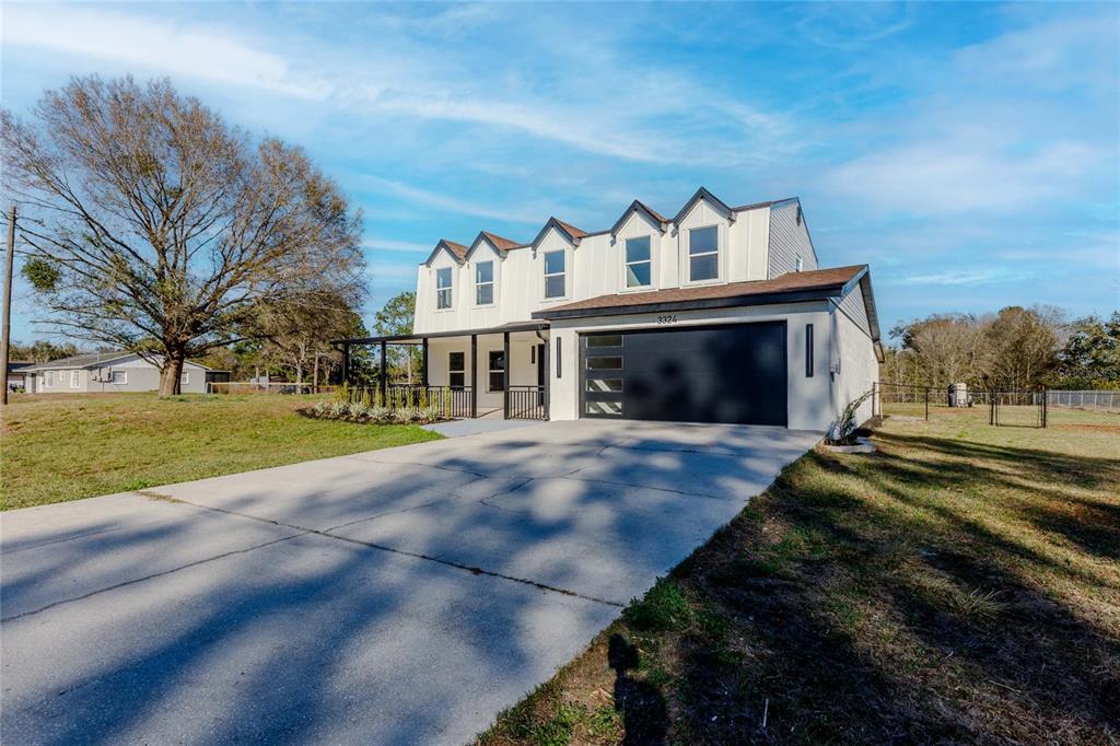 3324 Haystack Road Wesley Chapel, FL 33543 - Photo 91 of 91 a view of house with outdoor space and street view