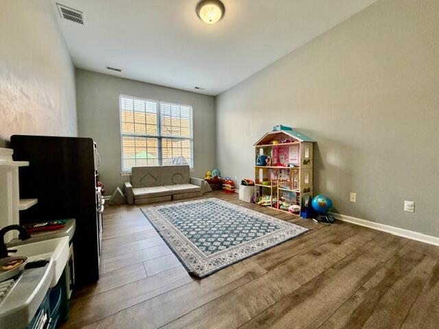 11610 Broadway Crown Point, IN 46307 - Photo 11 of 14 a living room with furniture rug and window