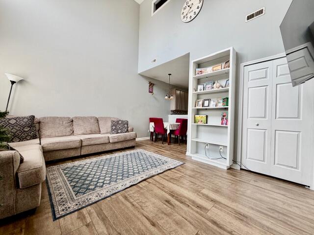 11610 Broadway Crown Point, IN 46307 - Photo 4 of 14 a living room with furniture and a wooden floor
