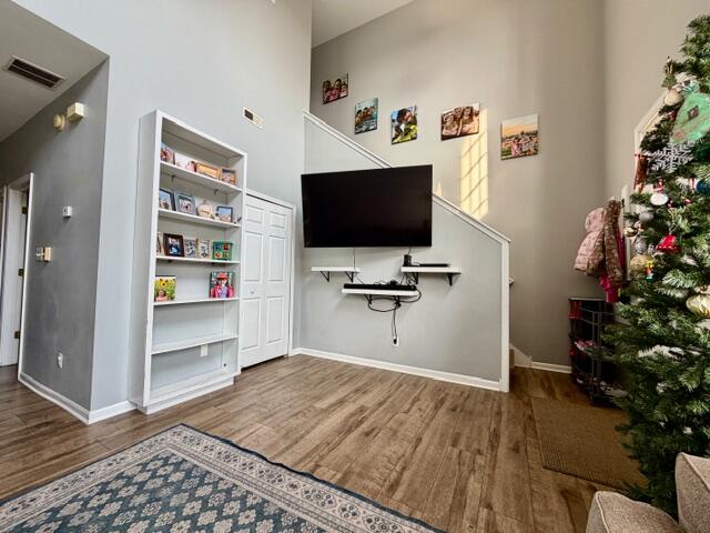 11610 Broadway Crown Point, IN 46307 - Photo 5 of 14 a view of a workspace with furniture and wooden floor