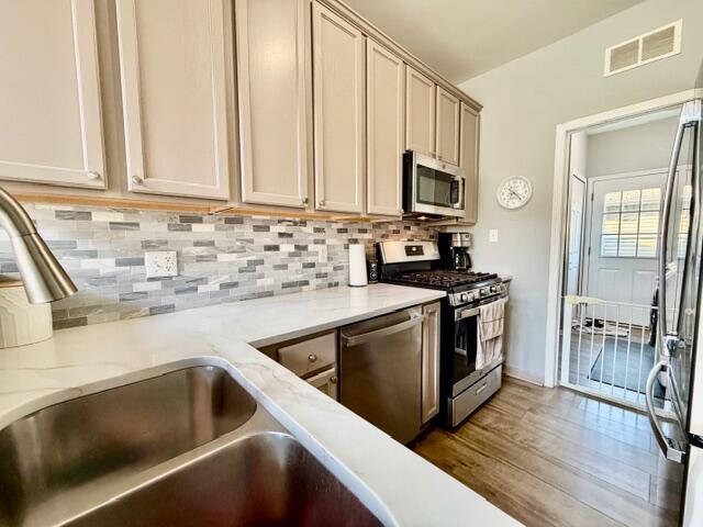 11610 Broadway Crown Point, IN 46307 - Photo 6 of 14 a kitchen with granite countertop a sink and a stove top oven