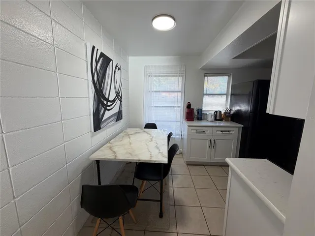 a kitchen with a sink cabinets and window