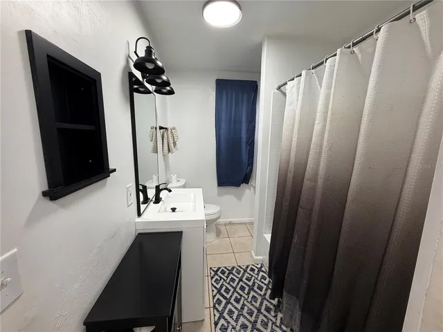 a bathroom with a sink a mirror and vanity