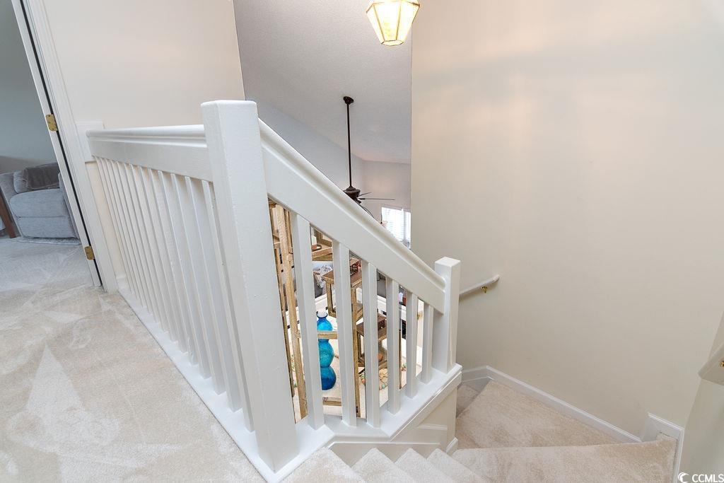 821 Sheridan Road, Unit 821 Myrtle Beach, SC 29579 - Photo 30 of 40 Staircase with carpet floors and ceiling fan