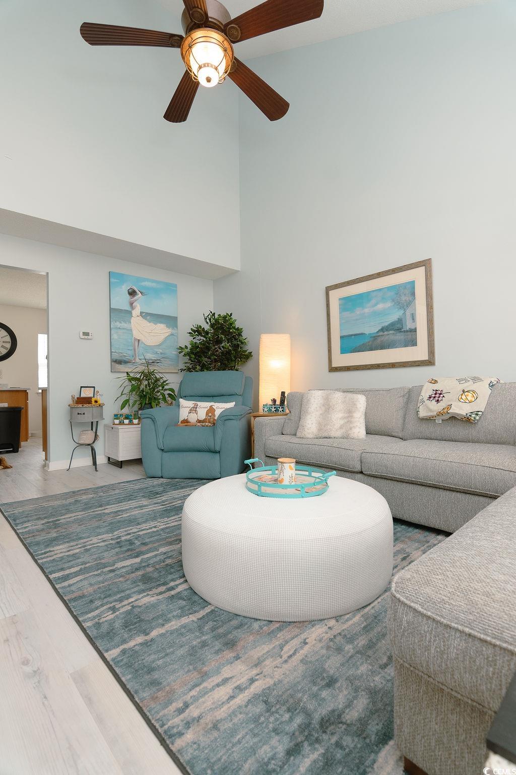 821 Sheridan Road, Unit 821 Myrtle Beach, SC 29579 - Photo 4 of 40 Living room with a towering ceiling, hardwood / wo