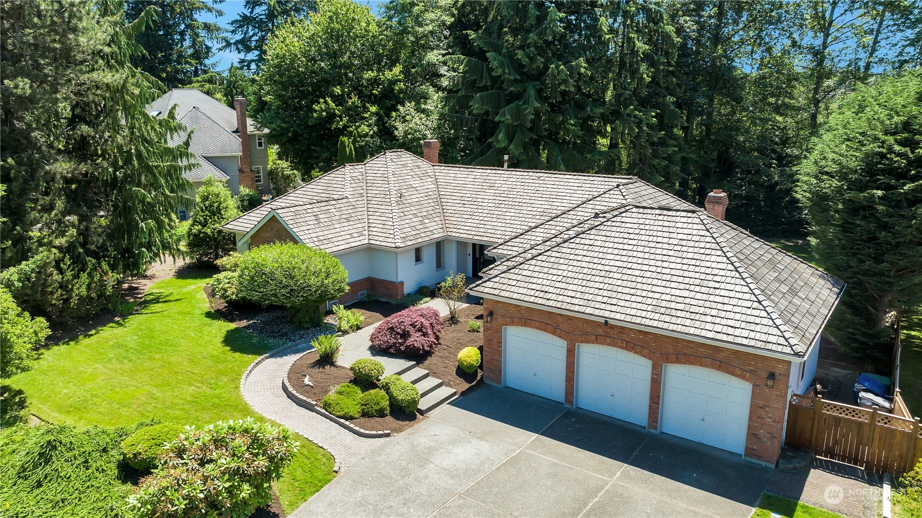 a aerial view of a house with a yard and outdoor seating