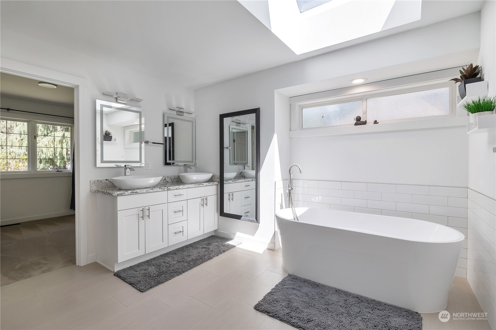 2926 184th Place Southeast Bothell, WA 98012 - Photo 11 of 24 a bathroom with a granite countertop sink mirror and bathtub