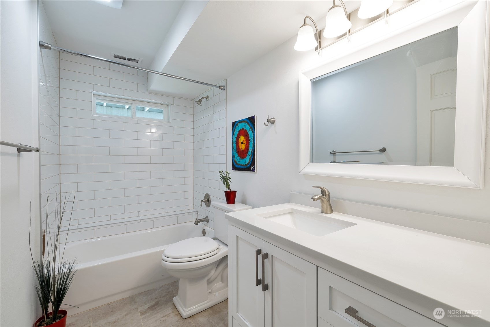 2926 184th Place Southeast Bothell, WA 98012 - Photo 18 of 24 a bathroom with a toilet a sink a mirror and a bathtub